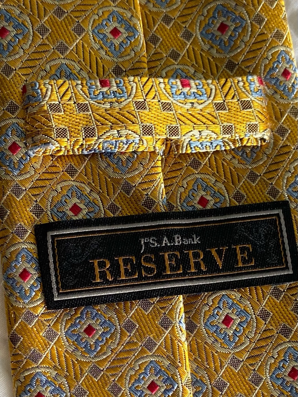 Jos. A. Bank Reserve 100% Silk Geometric Woven Logo Tie Vintage Gold Blue Red
